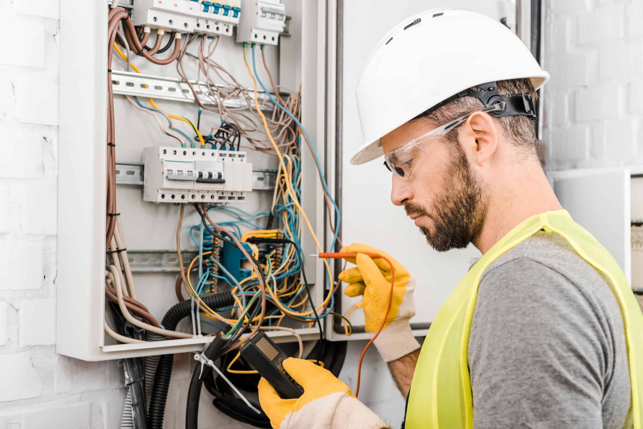Ionic electrician diagnosing a residential service panel